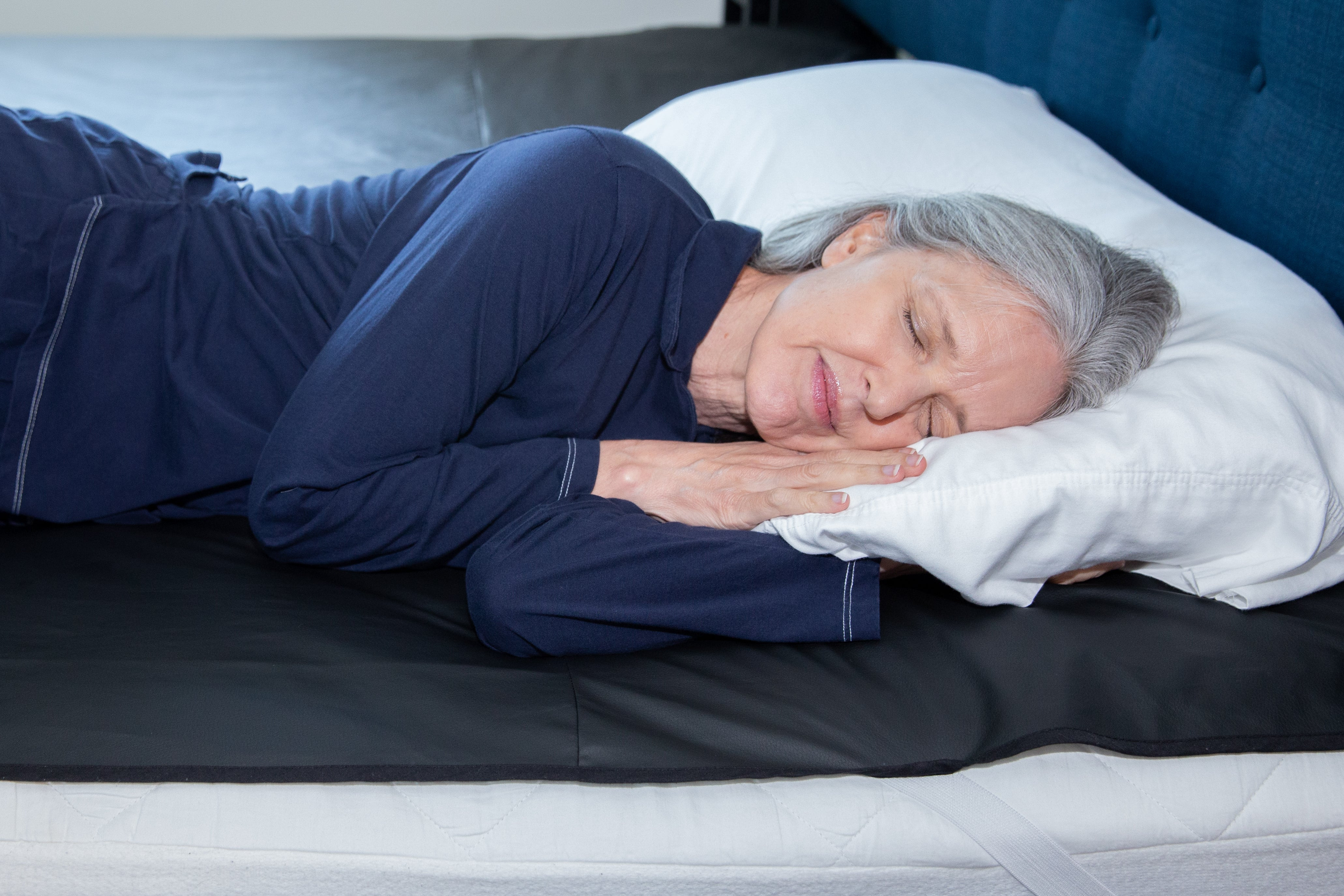 Woman.Sleeping.On.Mattress.Cover.Jpg